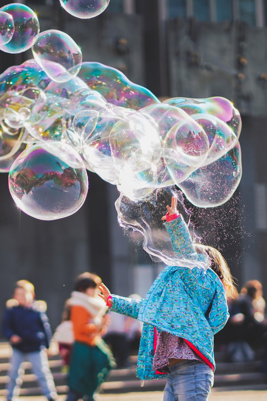 girl playing with bubbles